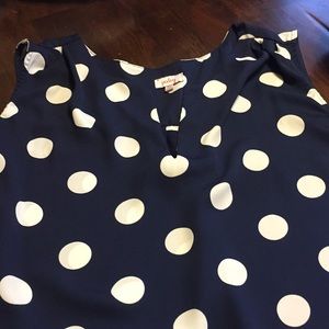 Sleeveless navy and creme polka dot blouse